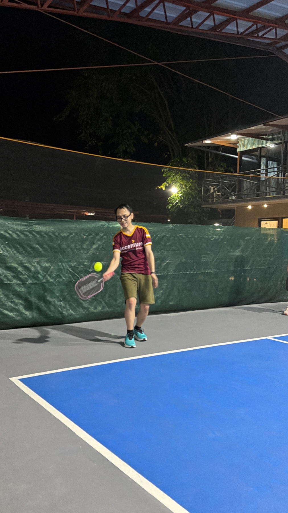Me on court that first night — borrowed paddle, no idea what I was doing