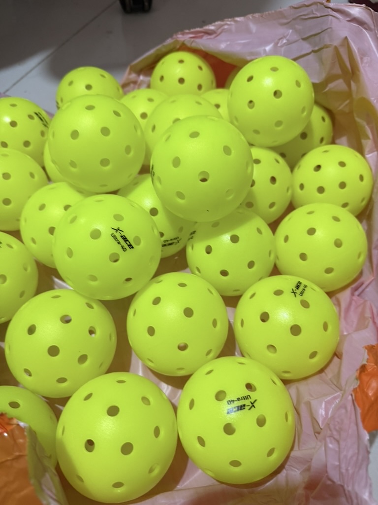 A bag of pickleballs — the chaos that an organized queue replaces