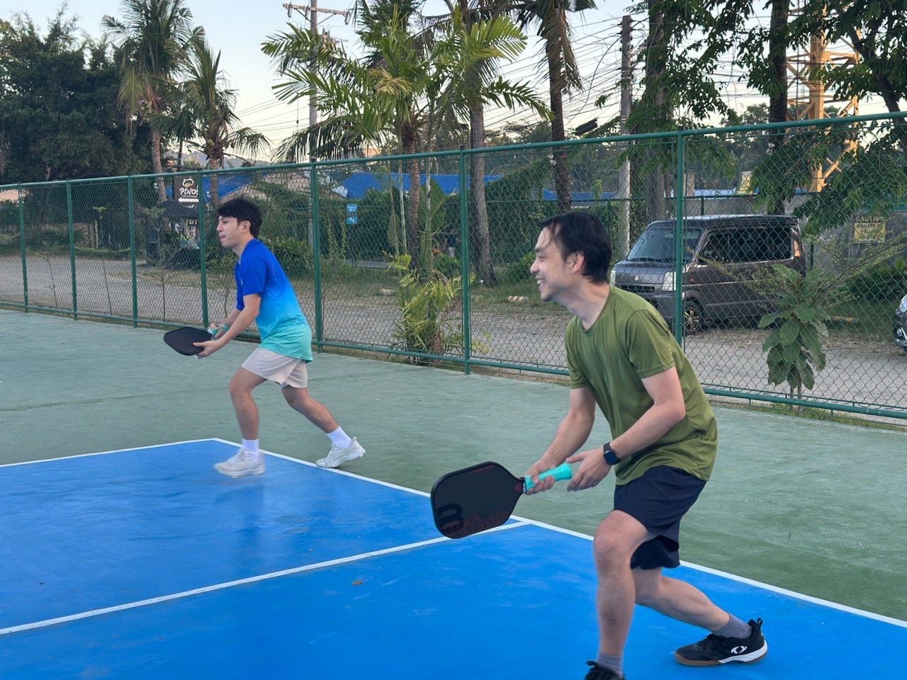 Mixed pickleball doubles in action — one of each gender per side
